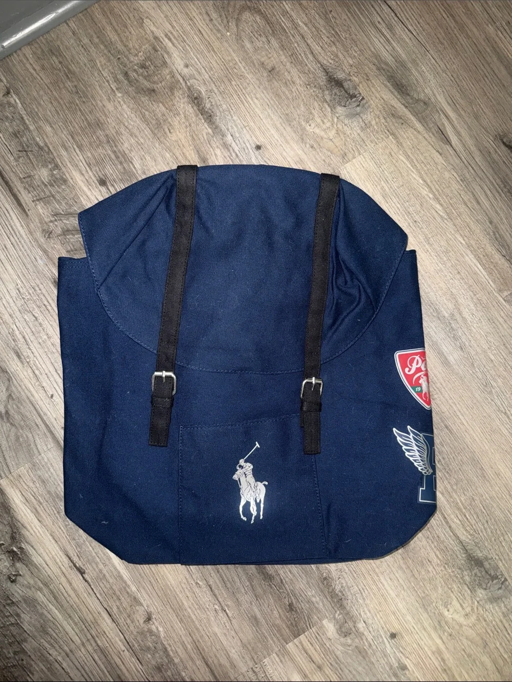 New, never used. PoloRalph Lauren Navy Canvas Backpack with Black Straps.